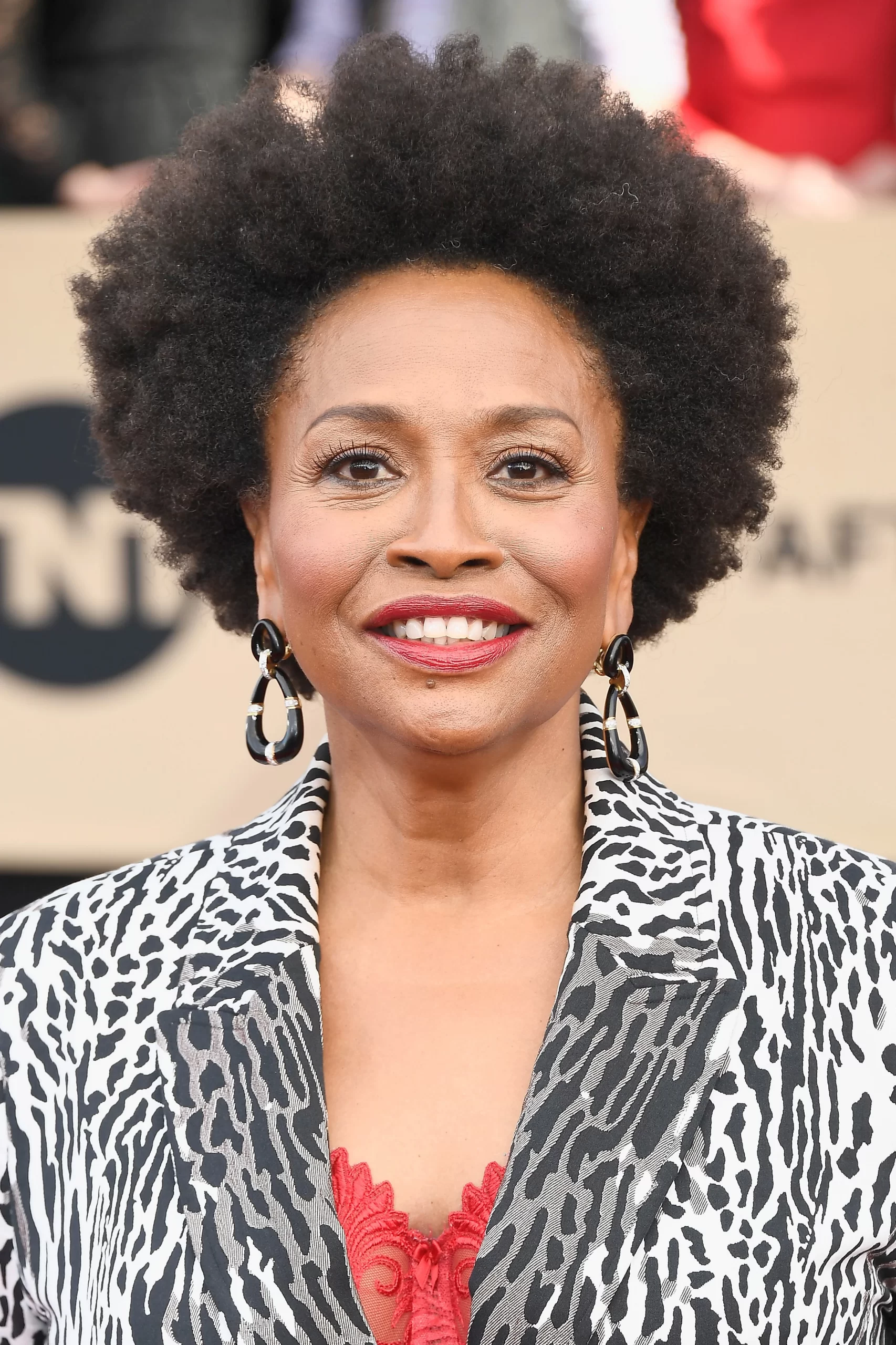 How did Jenifer Lewis start her on-screen career professionally