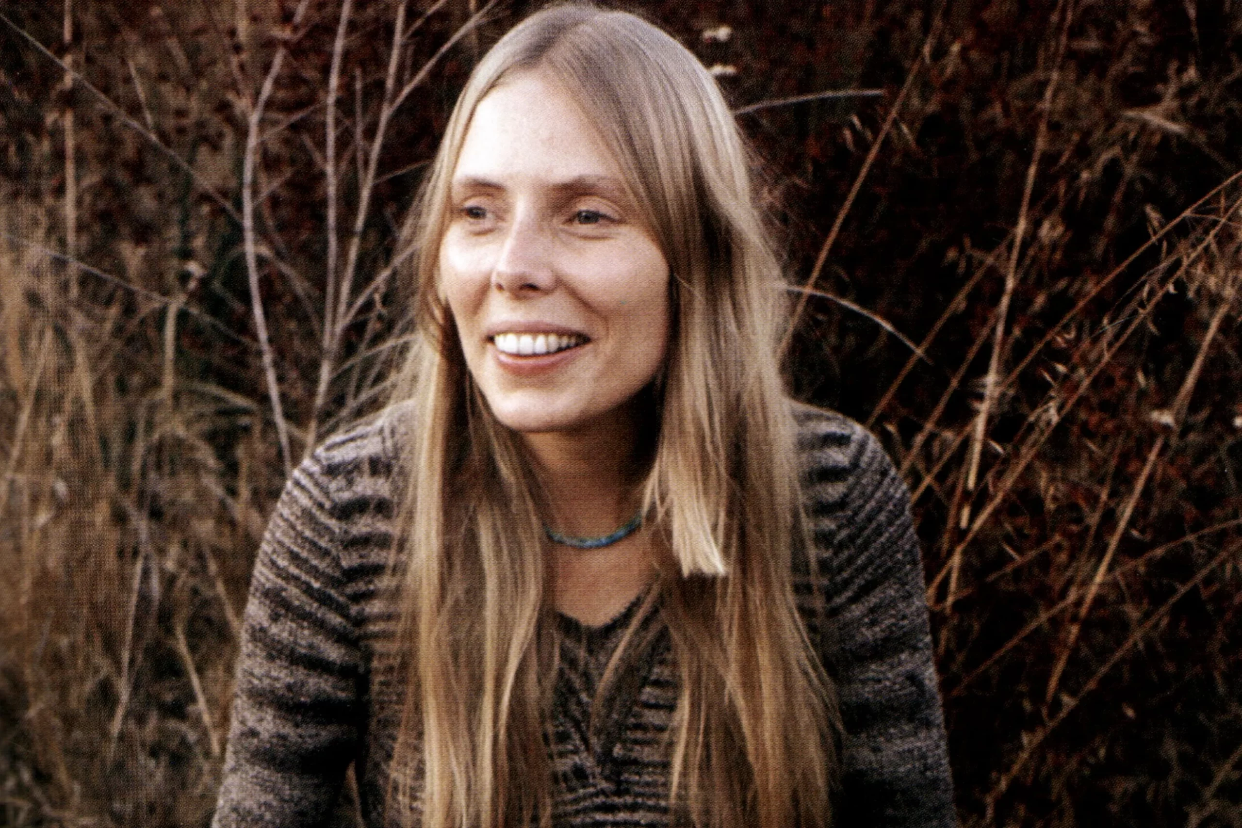 How old is Joni Mitchell, and what is her real name